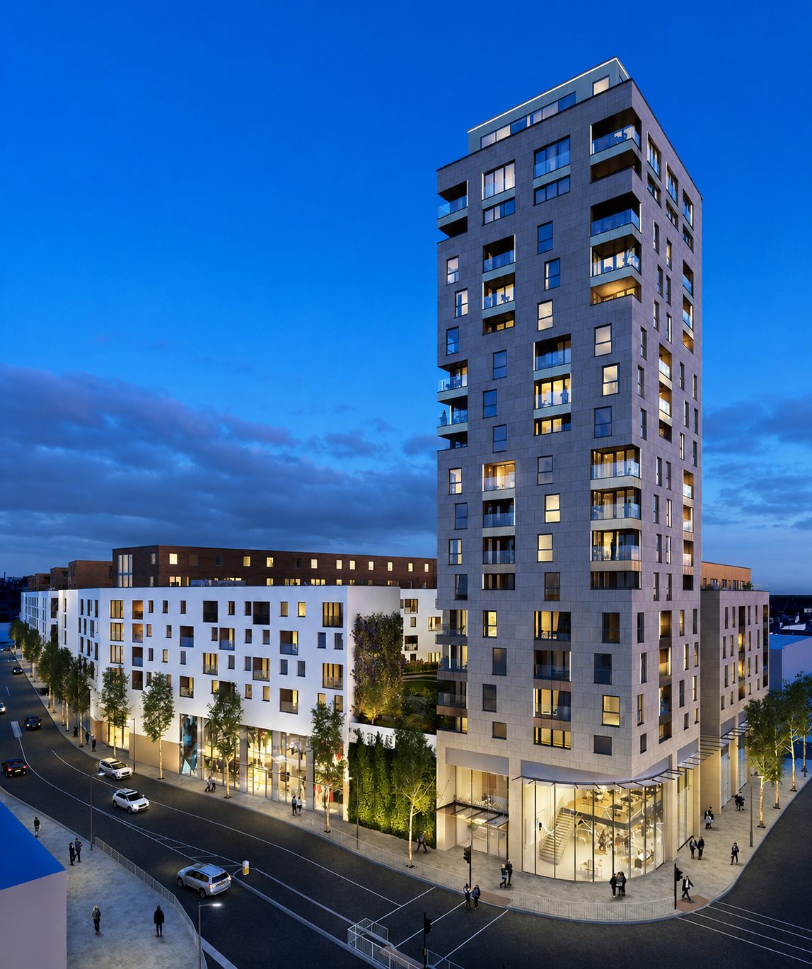 Everly House's stone-toned tower above the lit shopfronts and perimeter block at dusk, Colindale